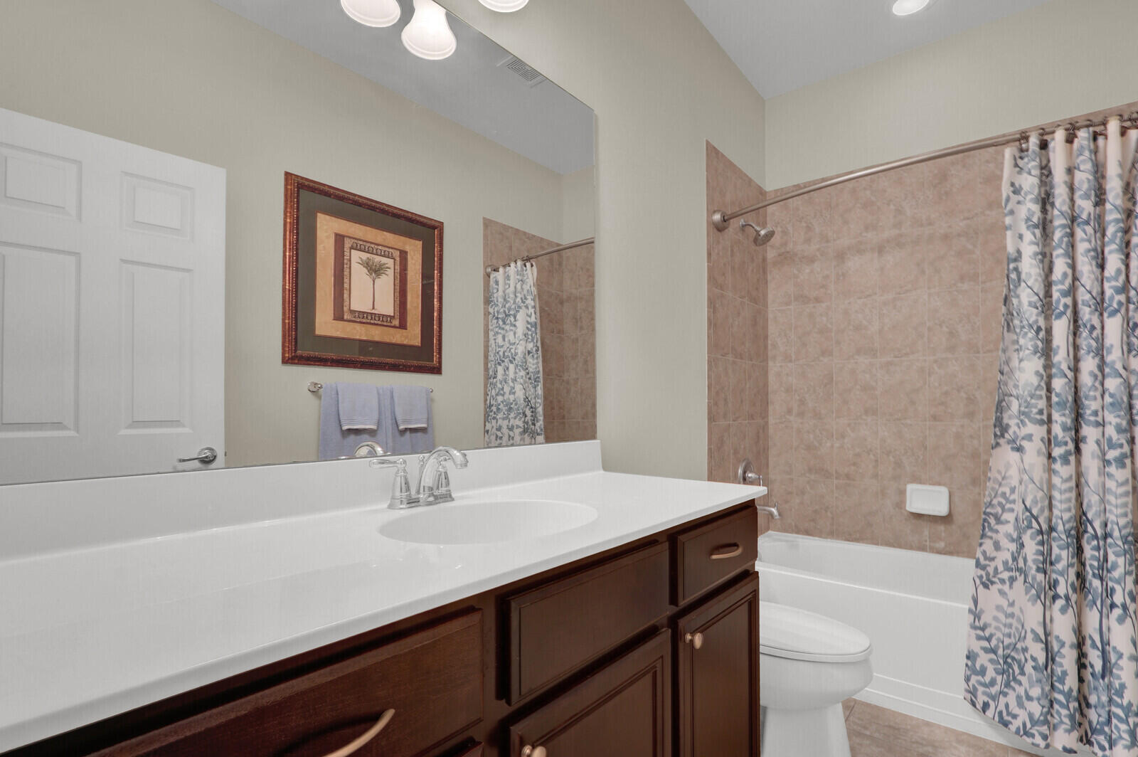 3277 East Mallory Boulevard Jupiter, FL 33458 - Photo 27 of 44 a bathroom with a sink a toilet a shower and a mirror