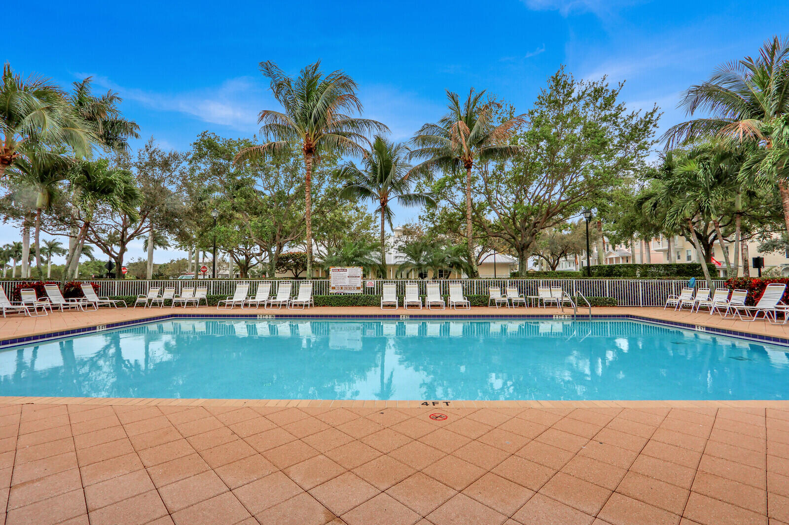 3277 East Mallory Boulevard Jupiter, FL 33458 - Photo 33 of 44 a view of swimming pool with a table and chairs in patio