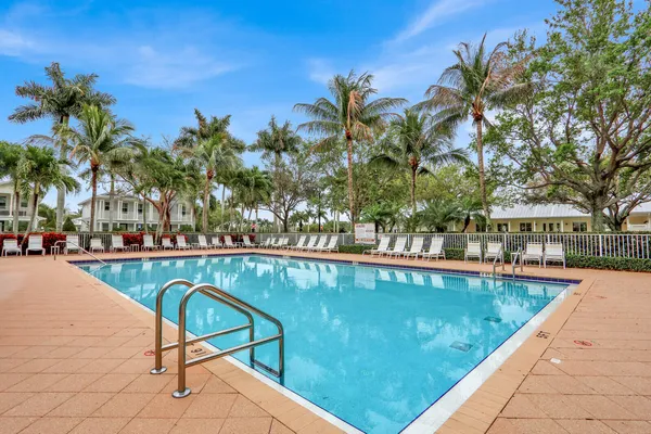 a view of swimming pool with lounge chair