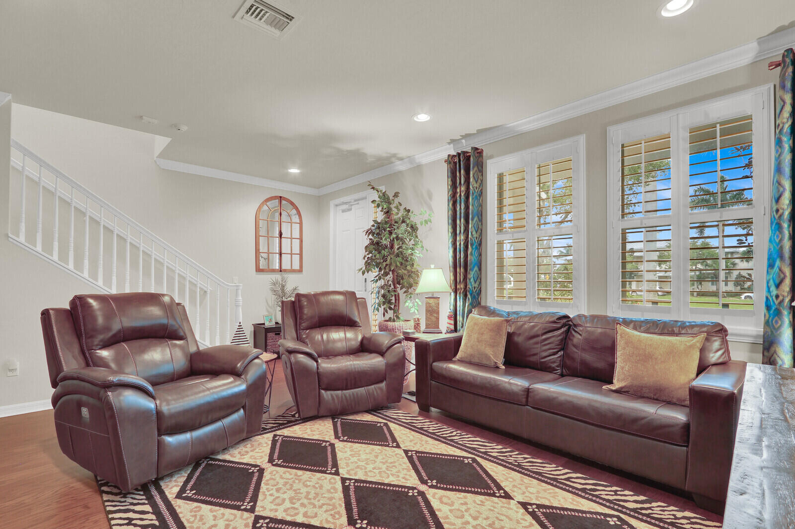3277 East Mallory Boulevard Jupiter, FL 33458 - Photo 8 of 44 a living room with furniture and a large window