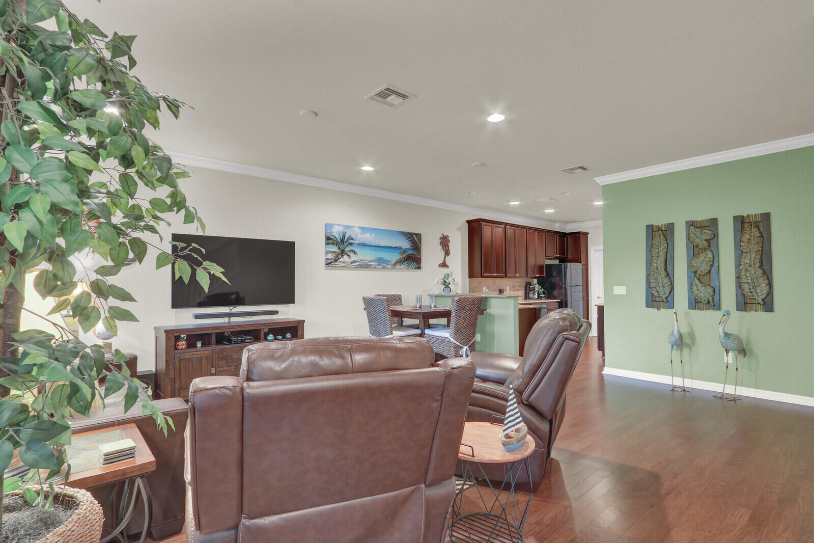 3277 East Mallory Boulevard Jupiter, FL 33458 - Photo 9 of 44 a living room with furniture and a flat screen tv