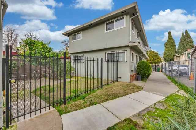a view of a balcony with chairs and a table