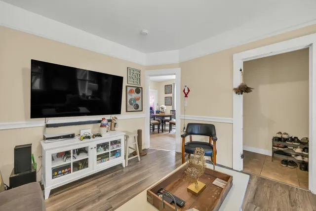 a kitchen with a refrigerator and a stove top oven