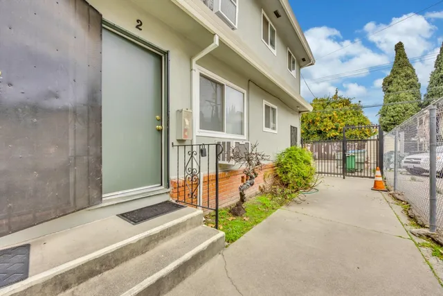a living room filled with furniture and a window