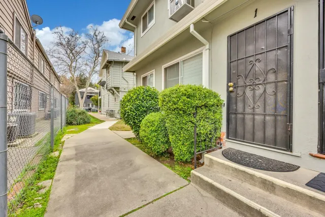 an aerial view of residential houses with outdoor space