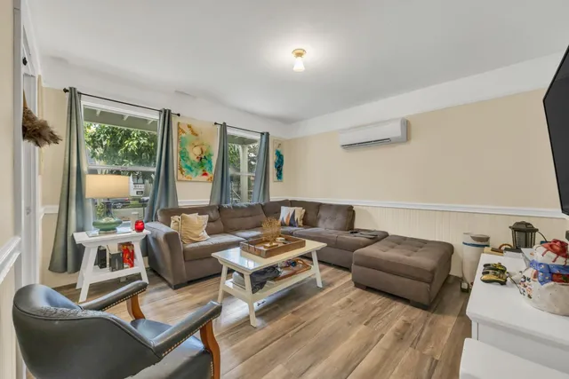 a view of a house with backyard and sitting area