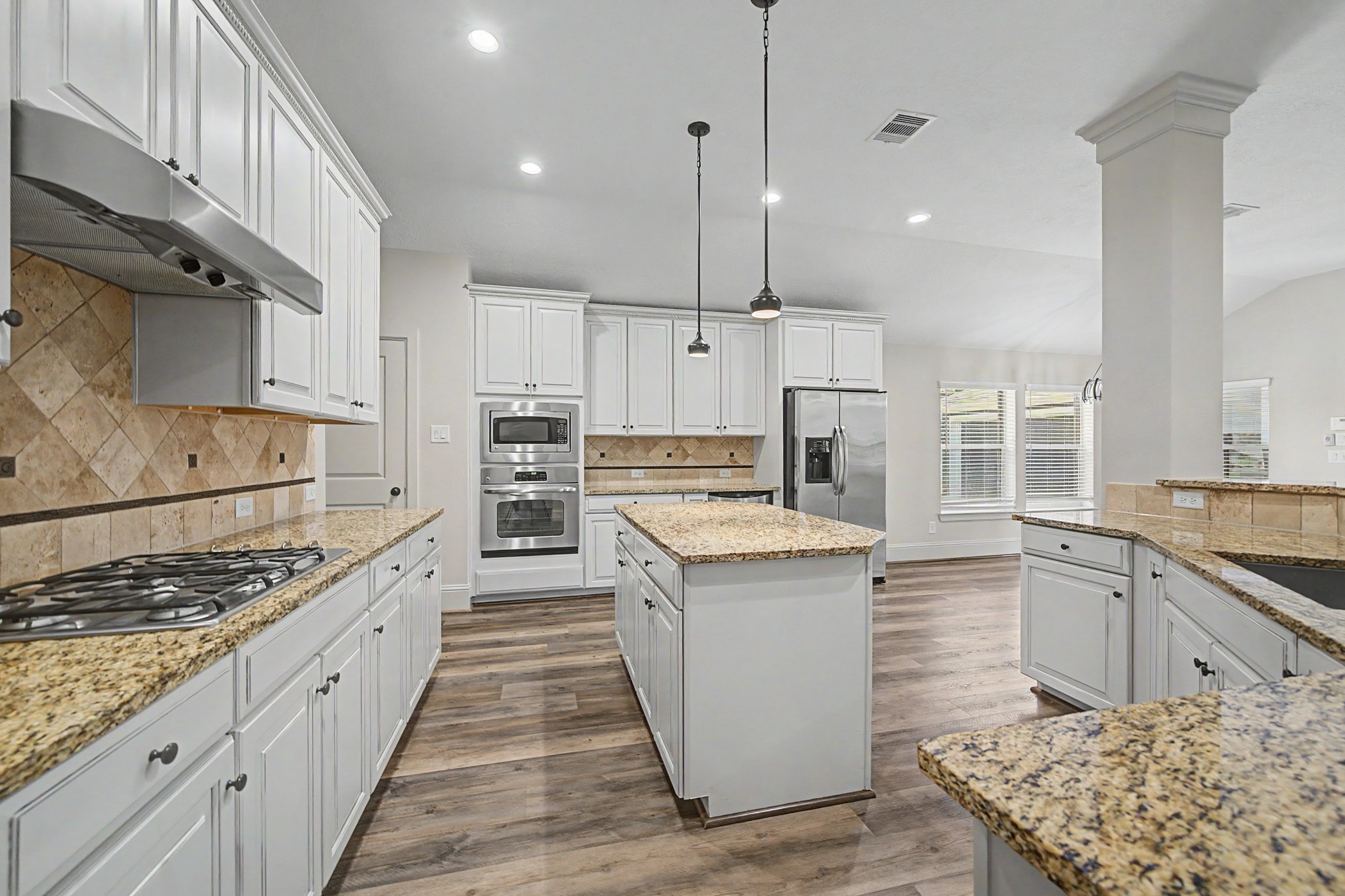 31032 Sunfall Trail Lane Spring, TX 77386 - Photo 14 of 39 a kitchen with stainless steel appliances granite countertop a stove and a sink