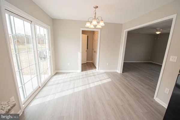 a kitchen with stainless steel appliances a refrigerator a sink a stove a microwave and cabinets