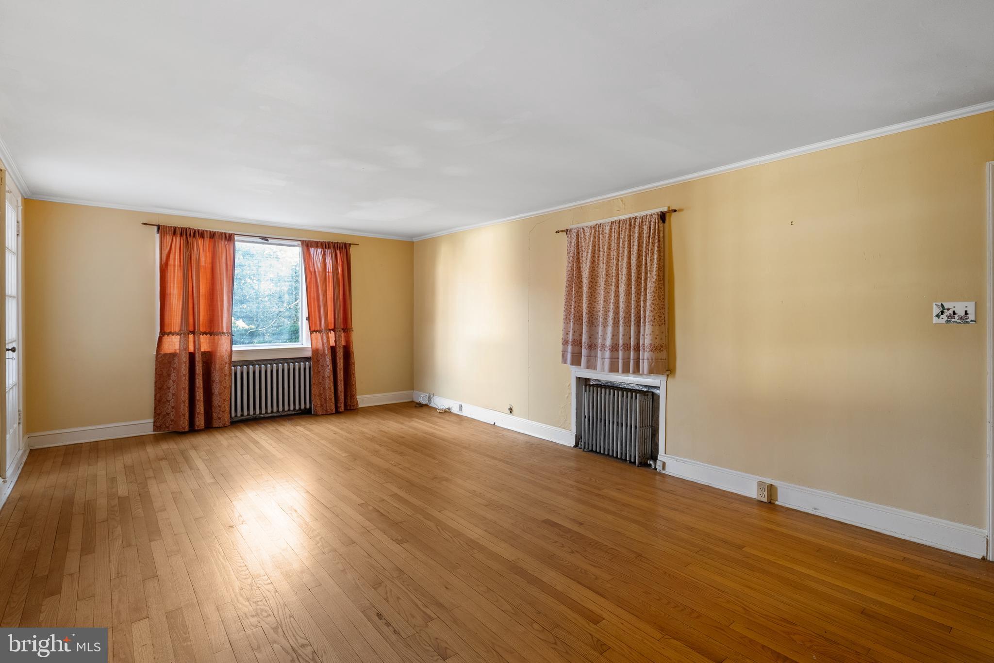 2200 Enterprise Road Bowie, MD 20721 - Photo 6 of 29 a view of an empty room with wooden floor and a window