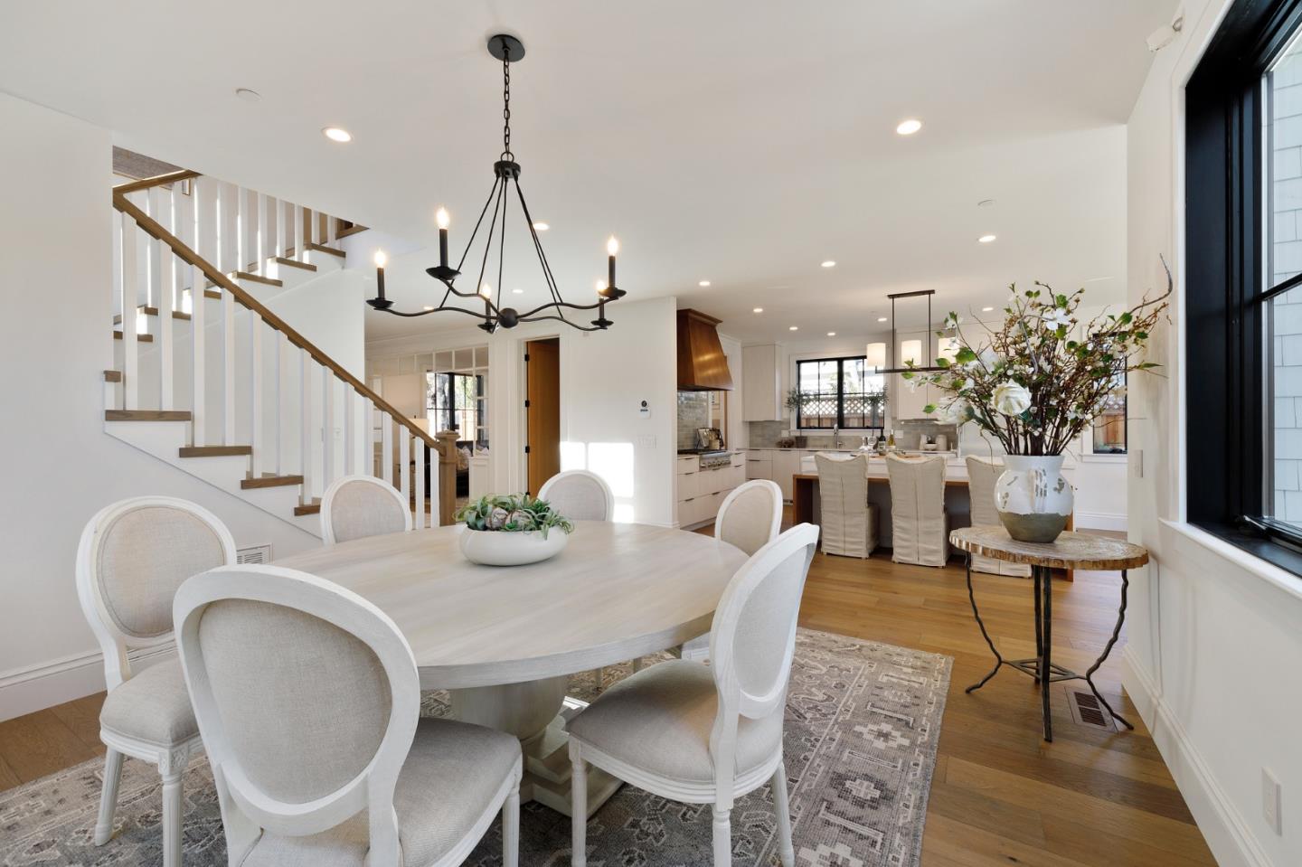 228 Stanley Road Burlingame, CA 94010 - Photo 25 of 100 a view of a dining room with furniture wooden floor and chandelier