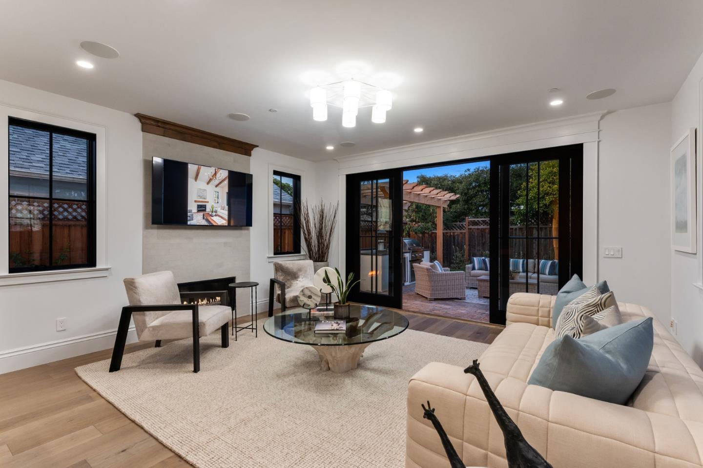 228 Stanley Road Burlingame, CA 94010 - Photo 47 of 100 a living room with furniture and large windows