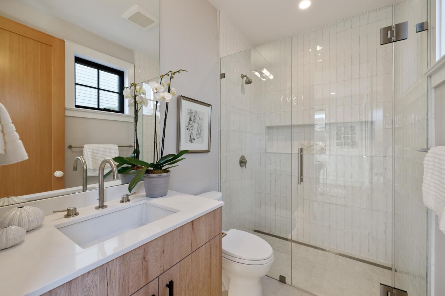 228 Stanley Road Burlingame, CA 94010 - Photo 52 of 100 a bathroom with a sink a toilet and shower