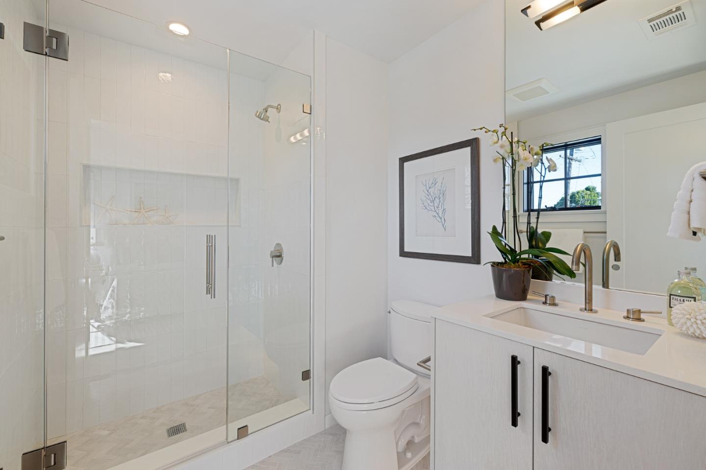 228 Stanley Road Burlingame, CA 94010 - Photo 81 of 100 a bathroom with a shower sink vanity mirror and toilet