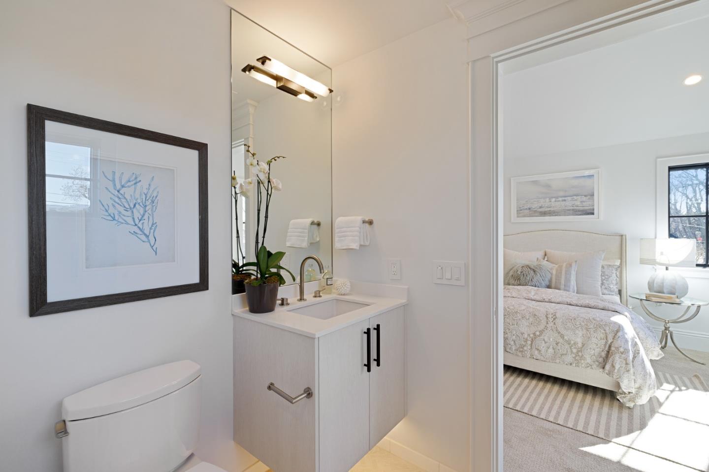 228 Stanley Road Burlingame, CA 94010 - Photo 82 of 100 a bathroom with a toilet sink and mirror