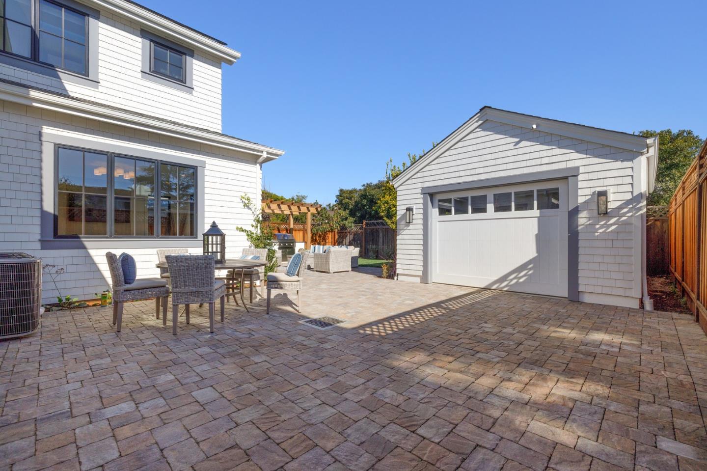 228 Stanley Road Burlingame, CA 94010 - Photo 88 of 100 a view of a house with backyard and a chair