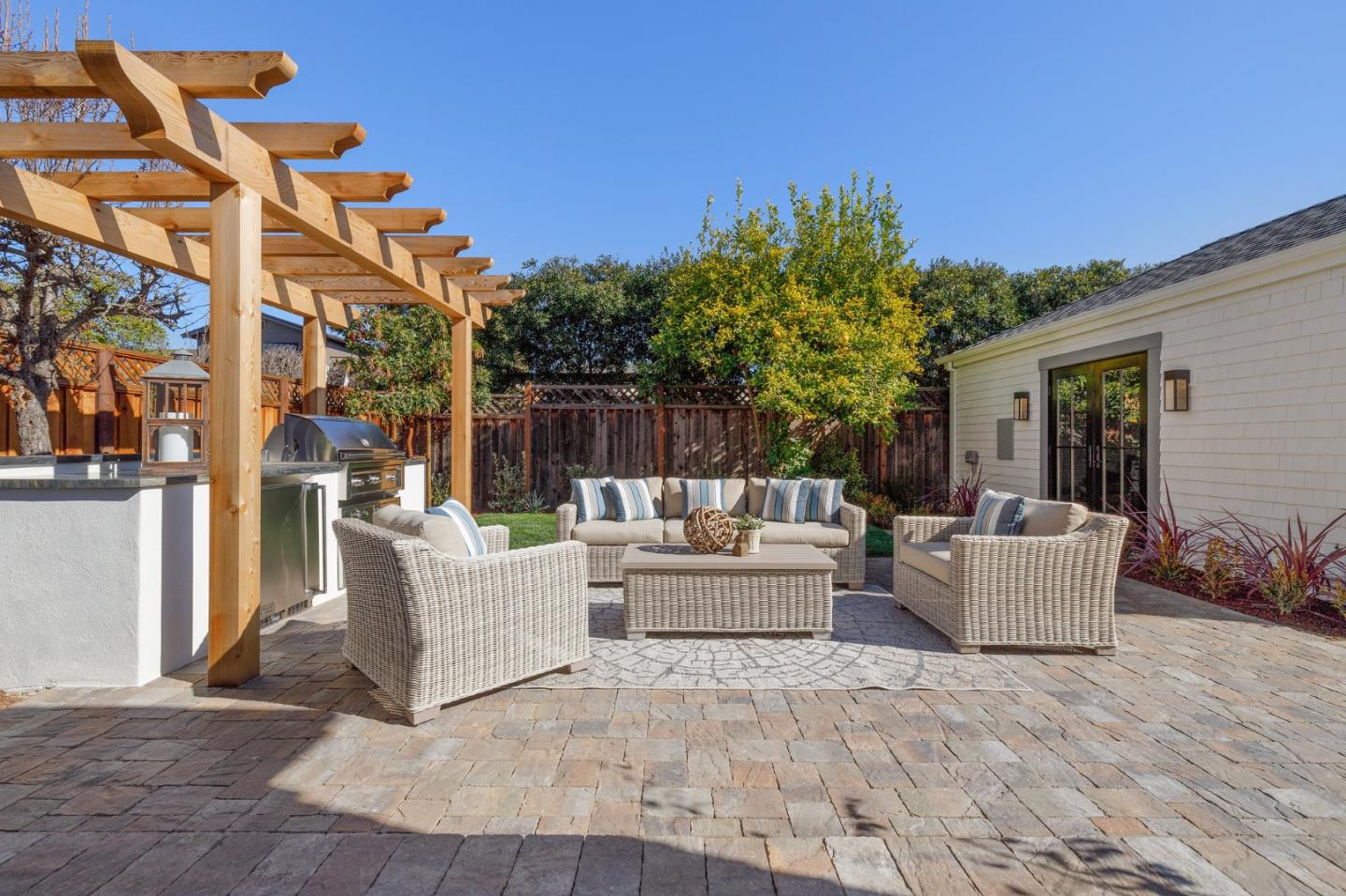 228 Stanley Road Burlingame, CA 94010 - Photo 90 of 100 a view of a patio with couches and potted plants