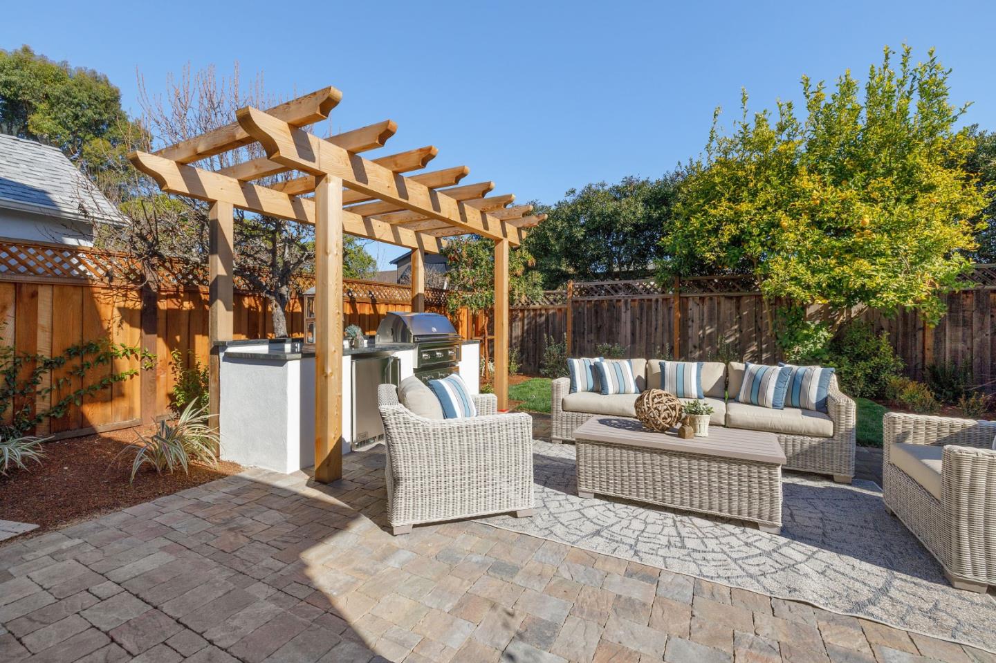 228 Stanley Road Burlingame, CA 94010 - Photo 91 of 100 a view of a terrace with couches and a fire pit