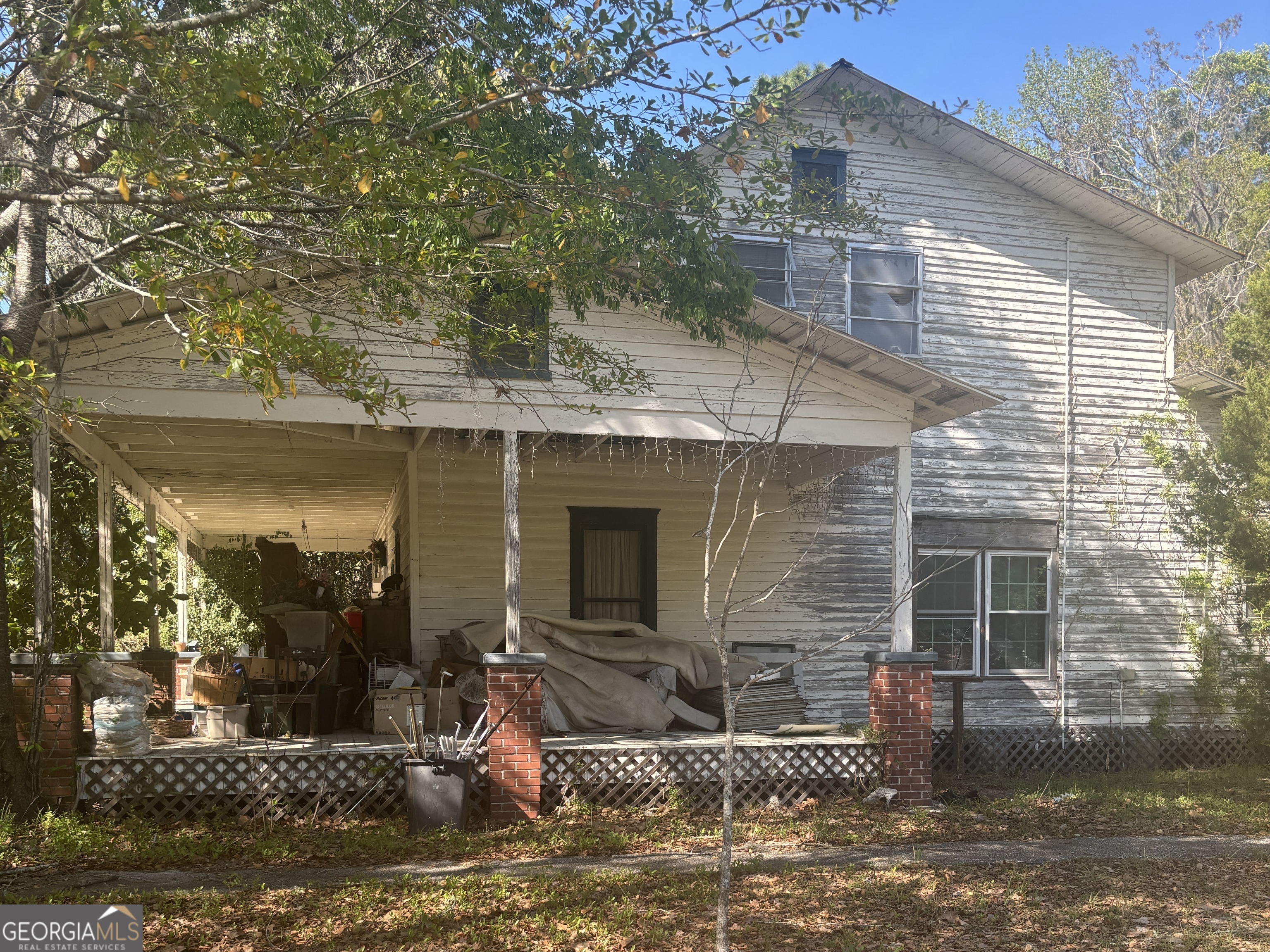 13272 Florida Avenue St. George, GA 31562 - Photo 3 of 16 a front view of a house with a yard