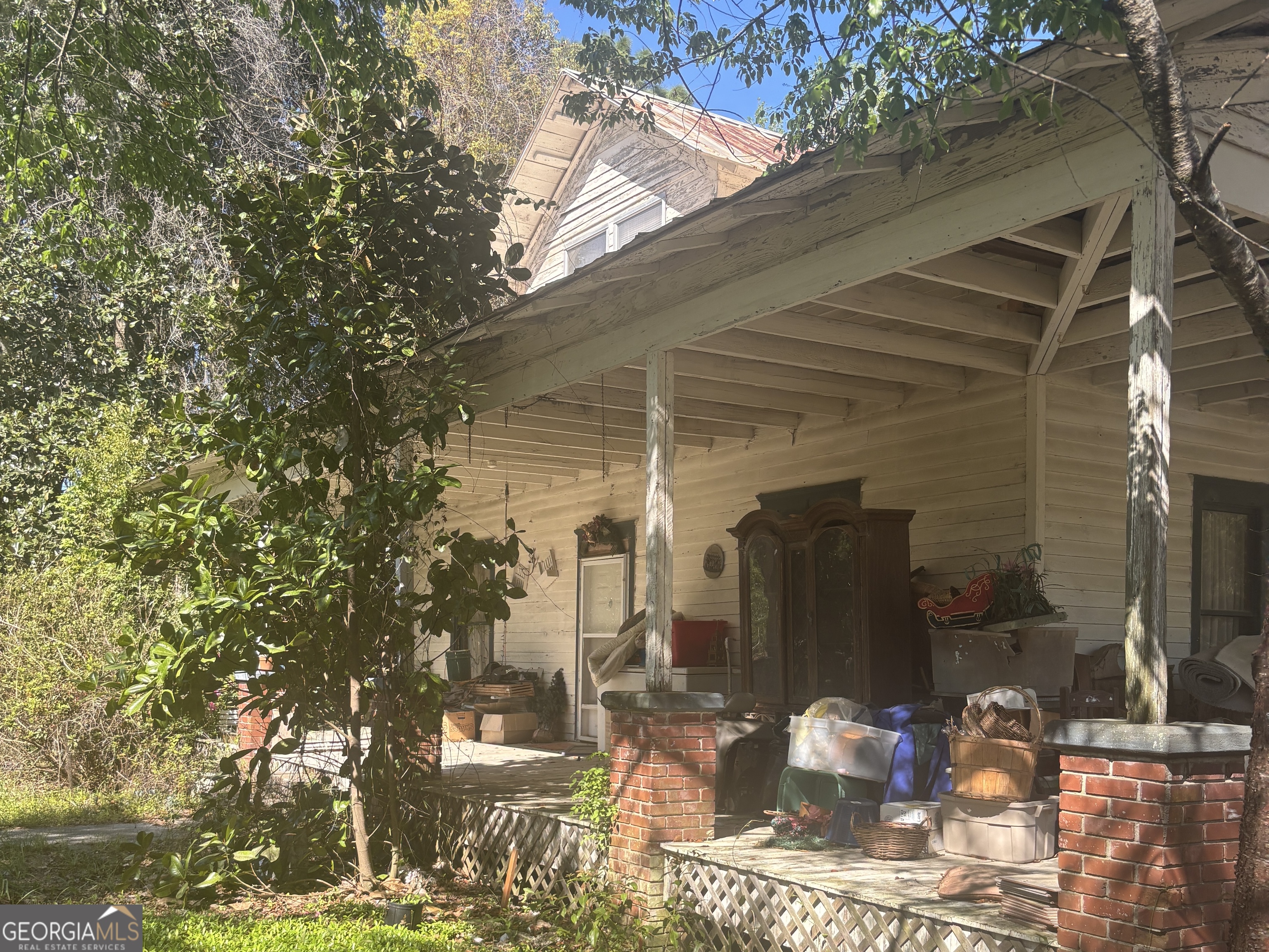 13272 Florida Avenue St. George, GA 31562 - Photo 5 of 16 a front view of a house with a yard