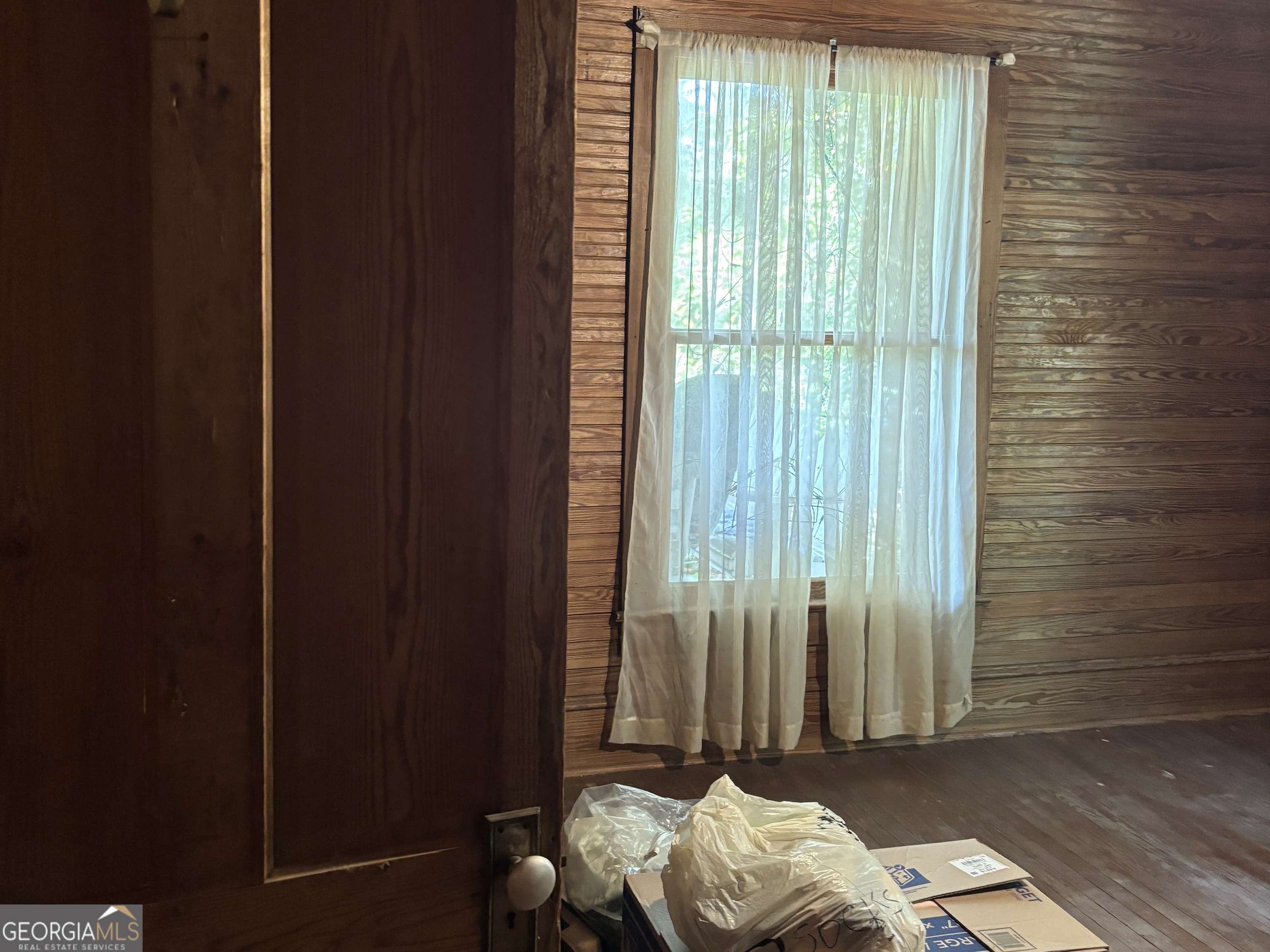 13272 Florida Avenue St. George, GA 31562 - Photo 8 of 16 a bed room with a bed and a window