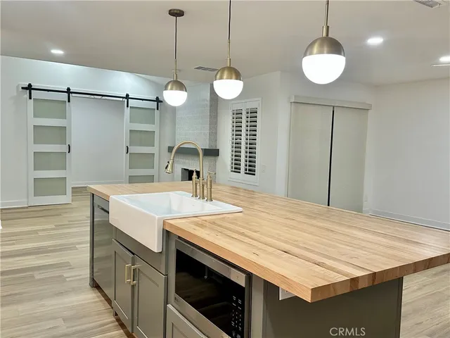 a bathroom with a sink a vanity and a shower