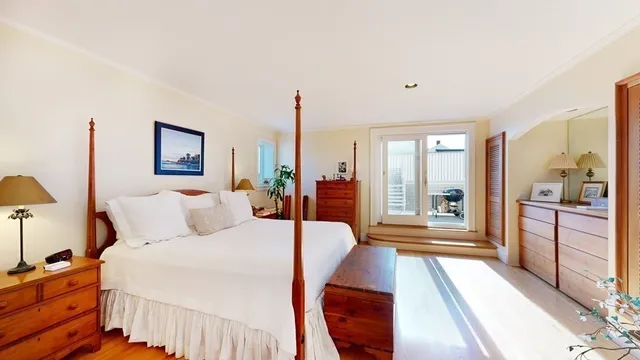 a bedroom with furniture and a window