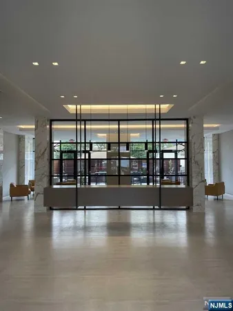 a view of an entryway with a floor to ceiling window