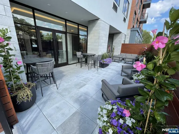 a view of a chairs and table in a patio