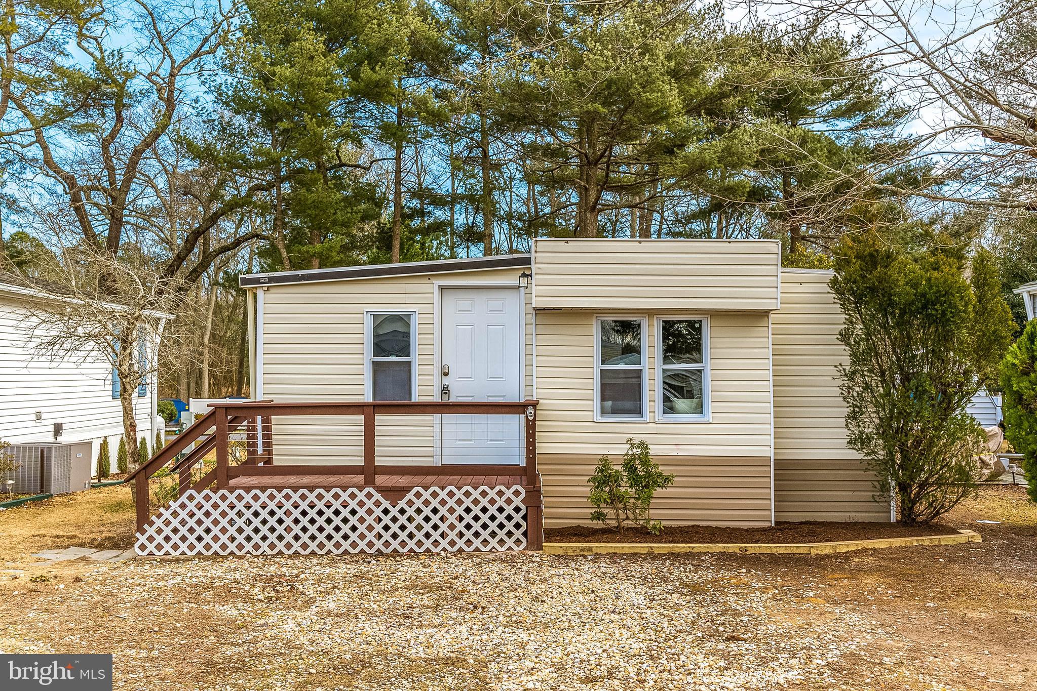 126 Skipjack Circle Berlin, MD 21811 - Photo 1 of 42 a front view of a house with a yard