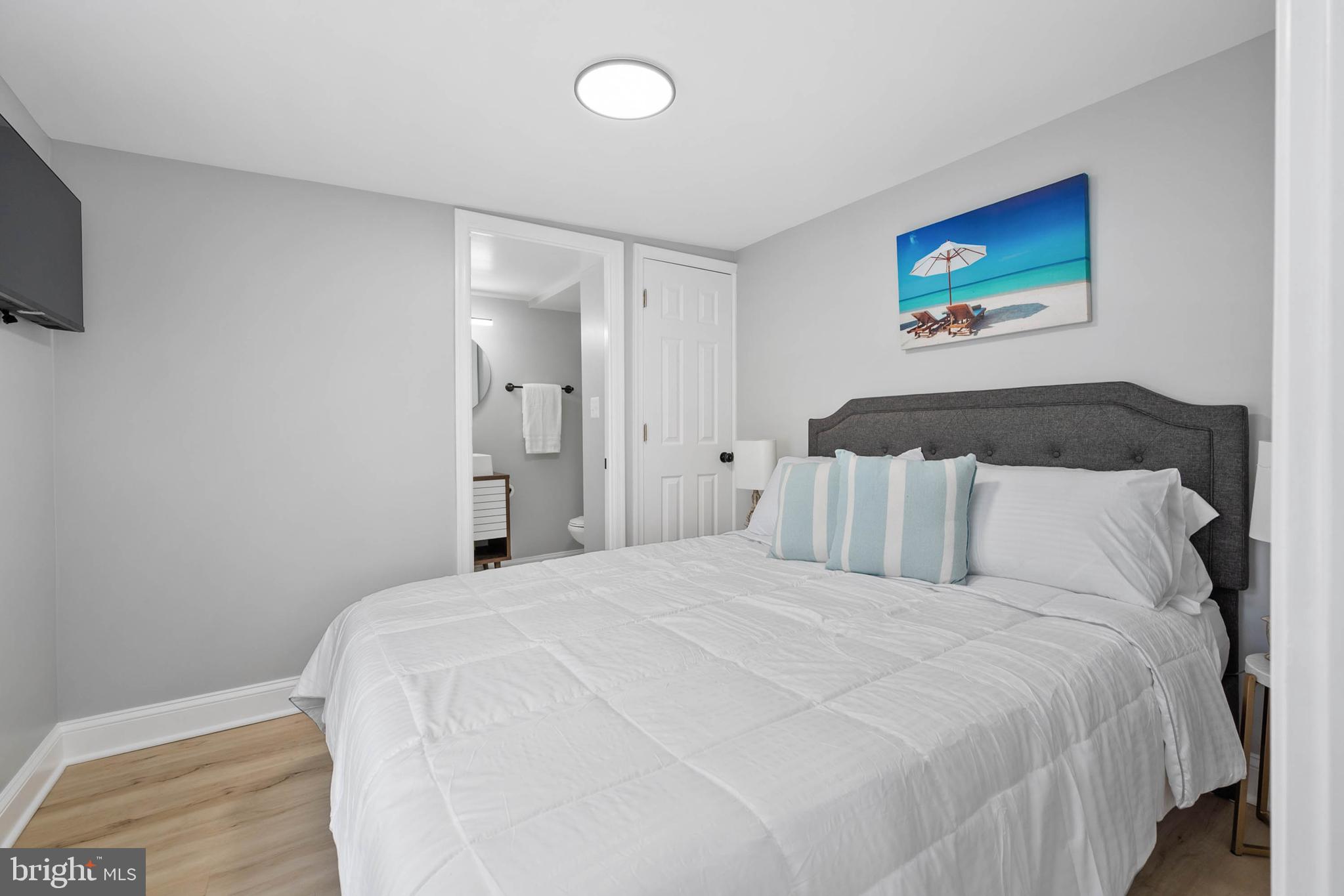 126 Skipjack Circle Berlin, MD 21811 - Photo 15 of 42 a large white bed in a white room