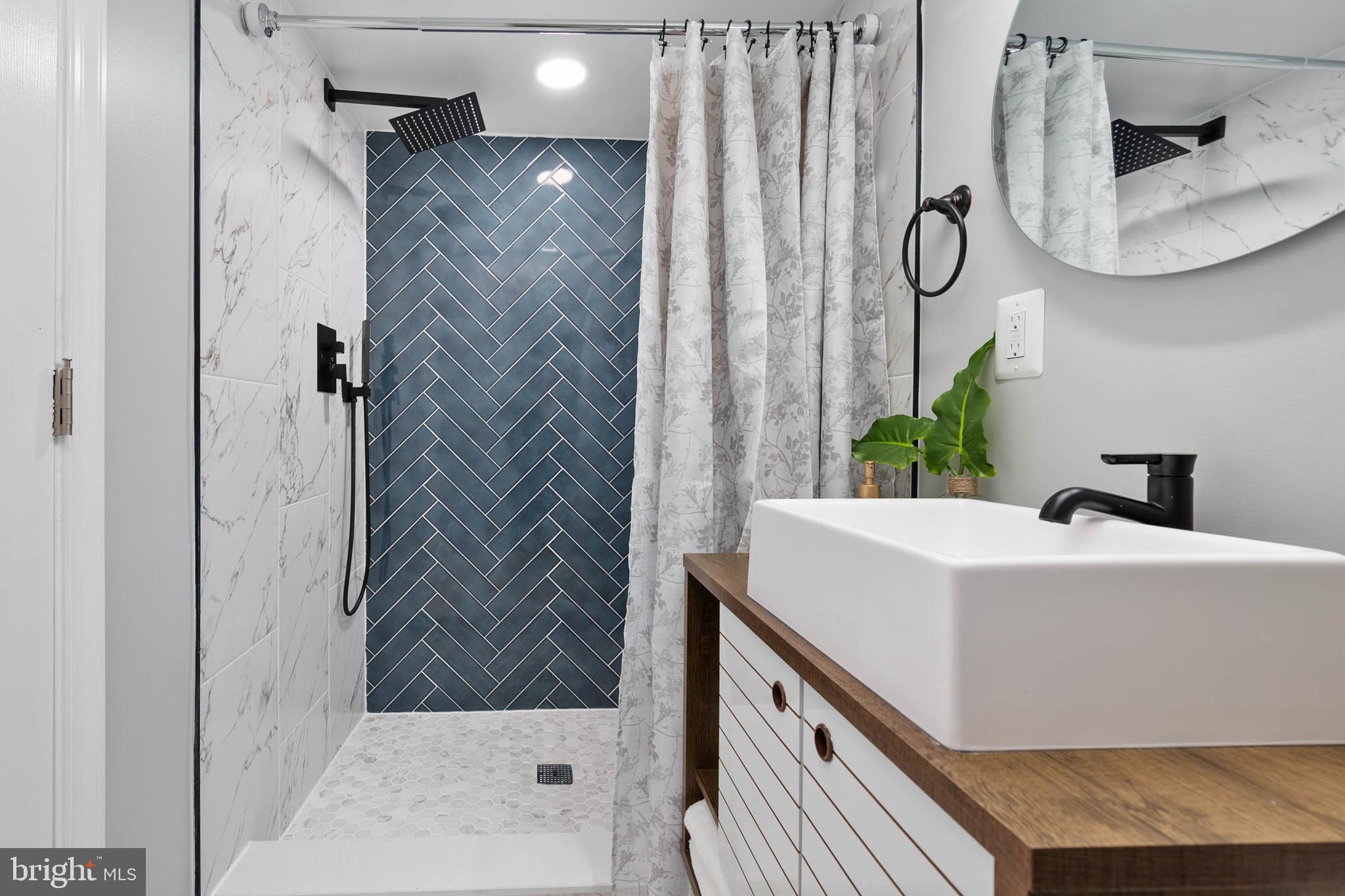 126 Skipjack Circle Berlin, MD 21811 - Photo 19 of 42 a bathroom with a sink and a mirror