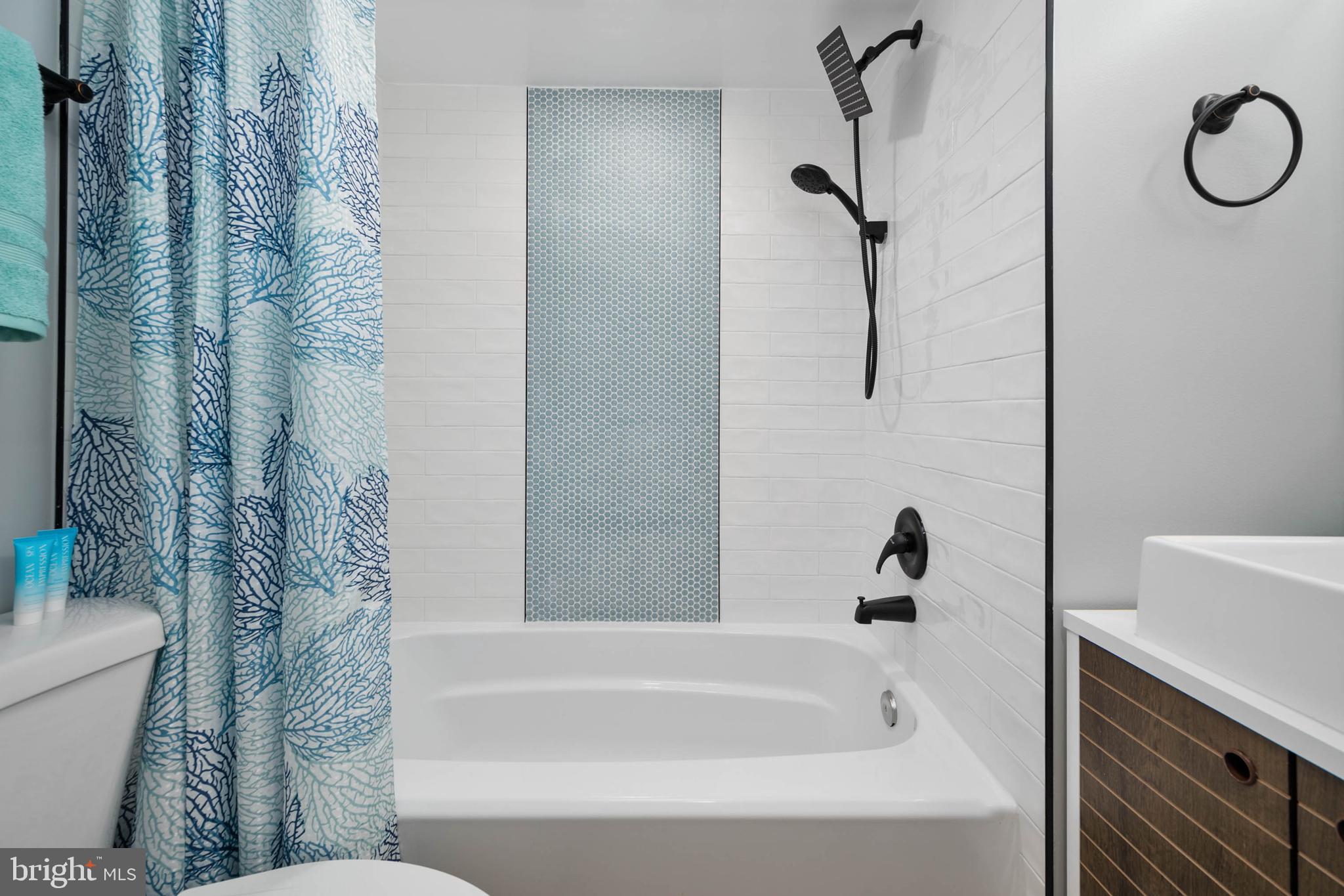 126 Skipjack Circle Berlin, MD 21811 - Photo 26 of 42 a bathroom with a bathtub a shower and a toilet