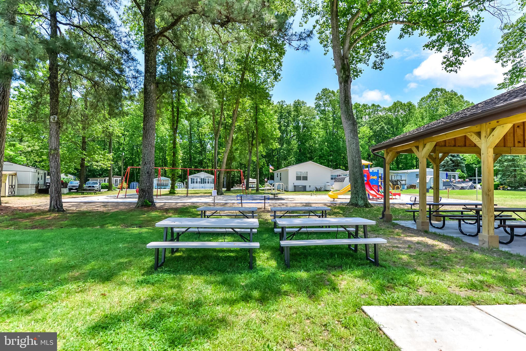 126 Skipjack Circle Berlin, MD 21811 - Photo 37 of 42 a park view with a bench and trees