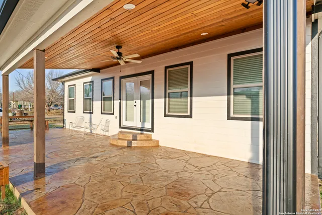 a view of a chairs and table in the patio
