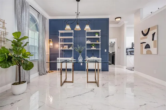 a view of living room with furniture and potted plant