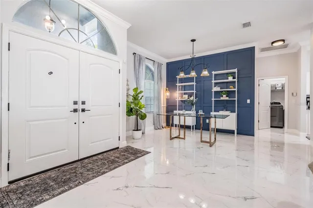 a view of a livingroom with furniture and a window