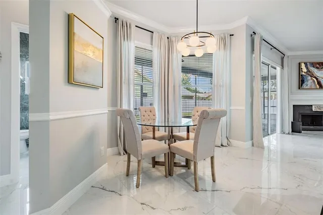 a dining room with furniture and window