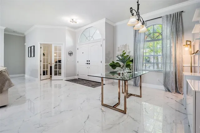 a view of a livingroom with furniture window and wooden floor