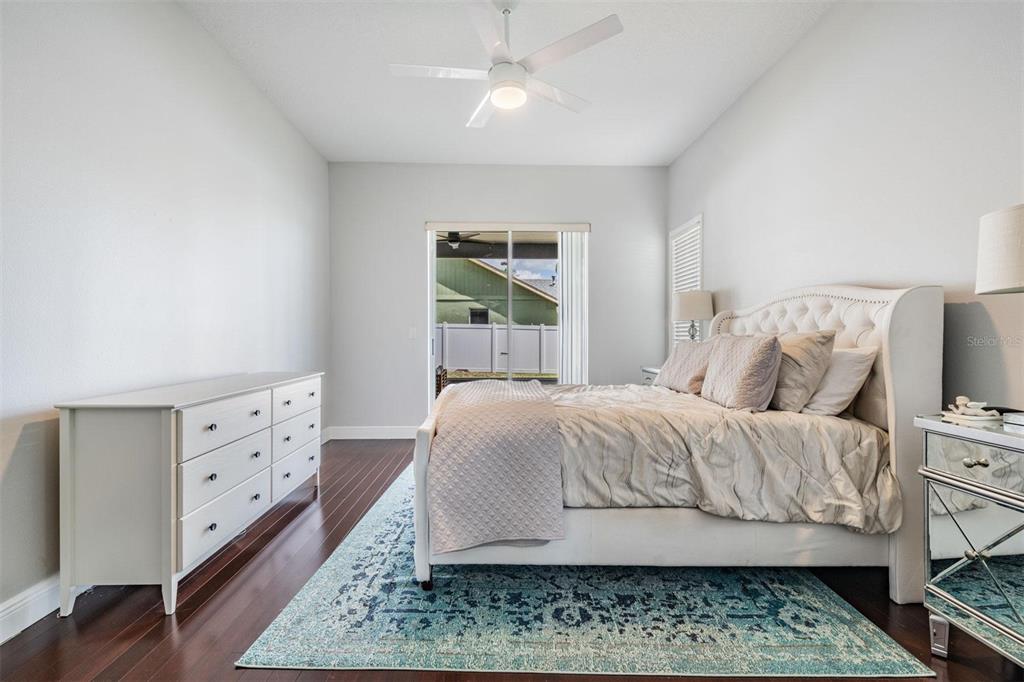 28335 Glade Fern Court Wesley Chapel, FL 33543 - Photo 24 of 44 a bedroom with a bed and a dresser