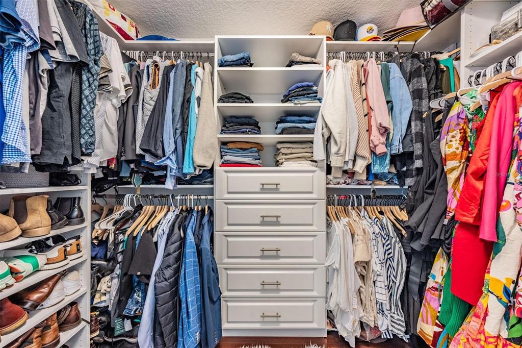 28335 Glade Fern Court Wesley Chapel, FL 33543 - Photo 25 of 44 a view of walk in closet with clothes and shoes