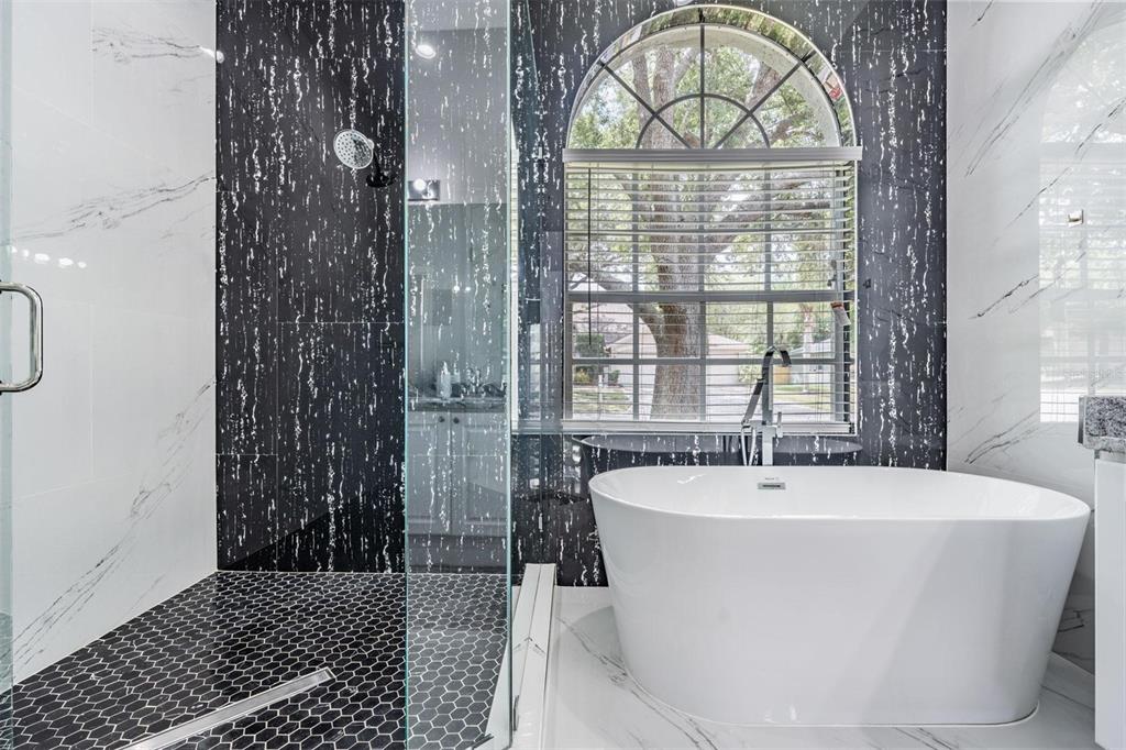 28335 Glade Fern Court Wesley Chapel, FL 33543 - Photo 26 of 44 a white bath tub sitting next to a window