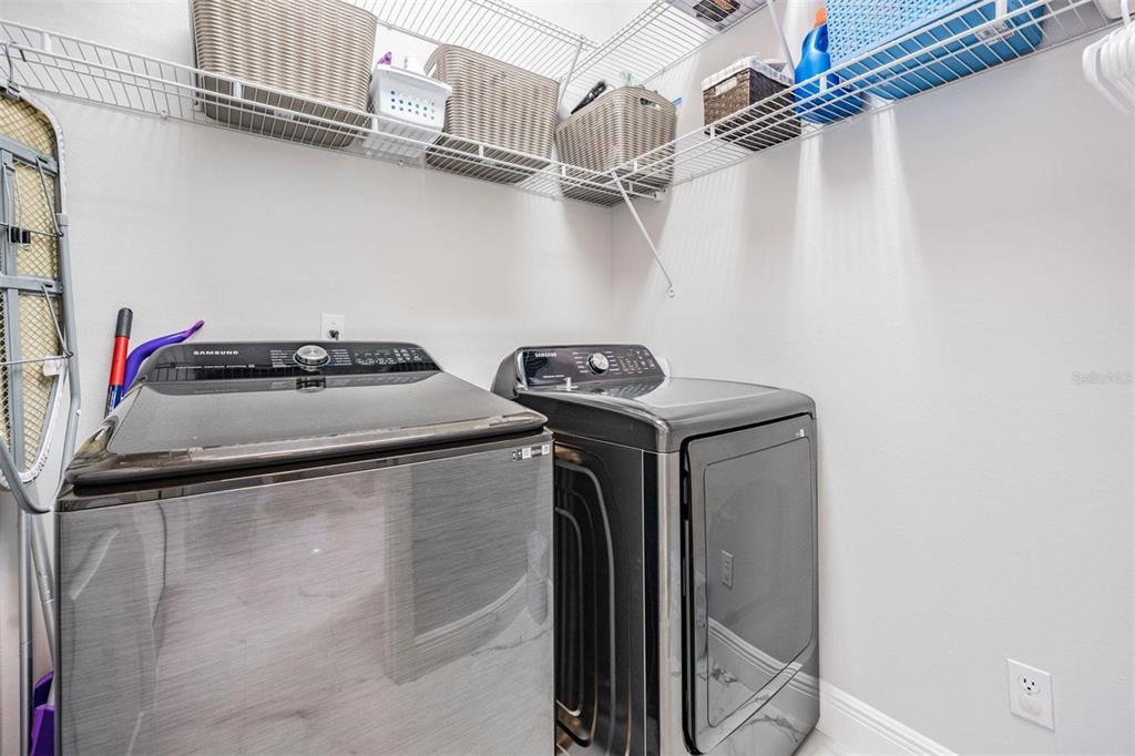 28335 Glade Fern Court Wesley Chapel, FL 33543 - Photo 33 of 44 a utility room with dryer and washer