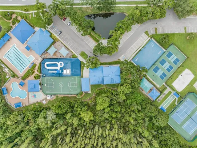 an aerial view of a house with garden space and street view