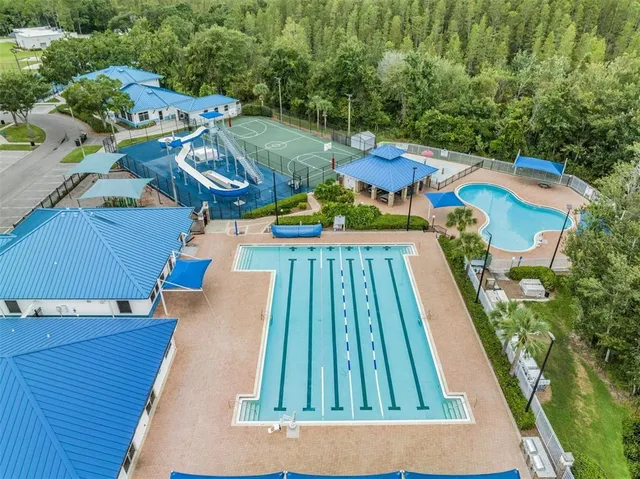 an aerial view of a house with a yard
