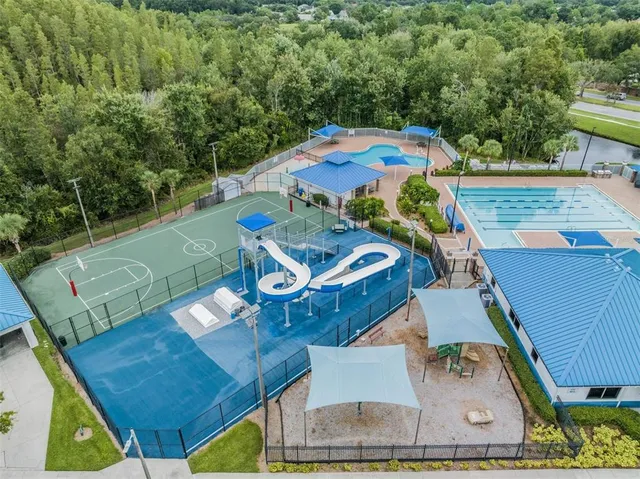an aerial view of a house with outdoor space