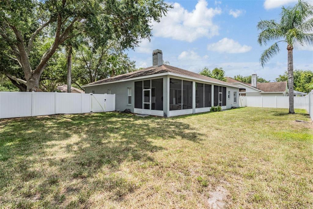 28335 Glade Fern Court Wesley Chapel, FL 33543 - Photo 5 of 44 a view of a house with a yard and potted plants