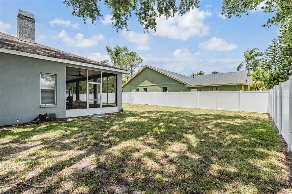 28335 Glade Fern Court Wesley Chapel, FL 33543 - Photo 6 of 44 a view of a house with a garden and yard