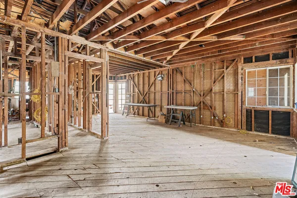 a view of a room with wooden walls