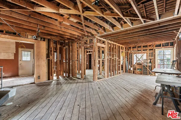 a view of porch with wooden floor