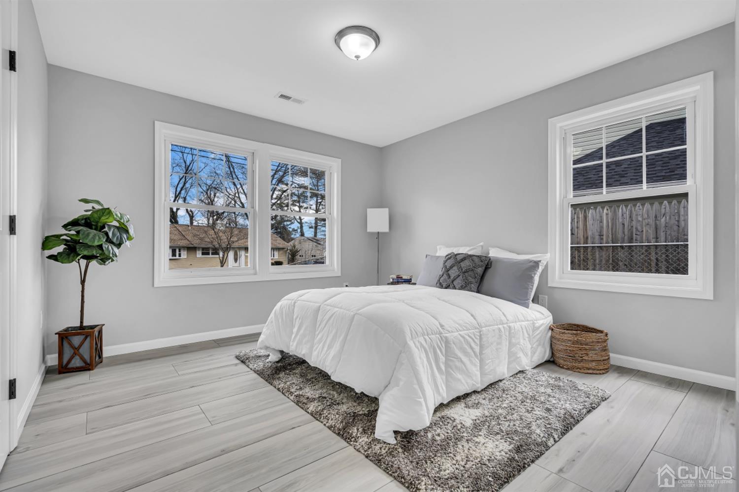 10 Dayton Road Edison, NJ 08817 - Photo 14 of 35 a spacious bedroom with a bed and a potted plant